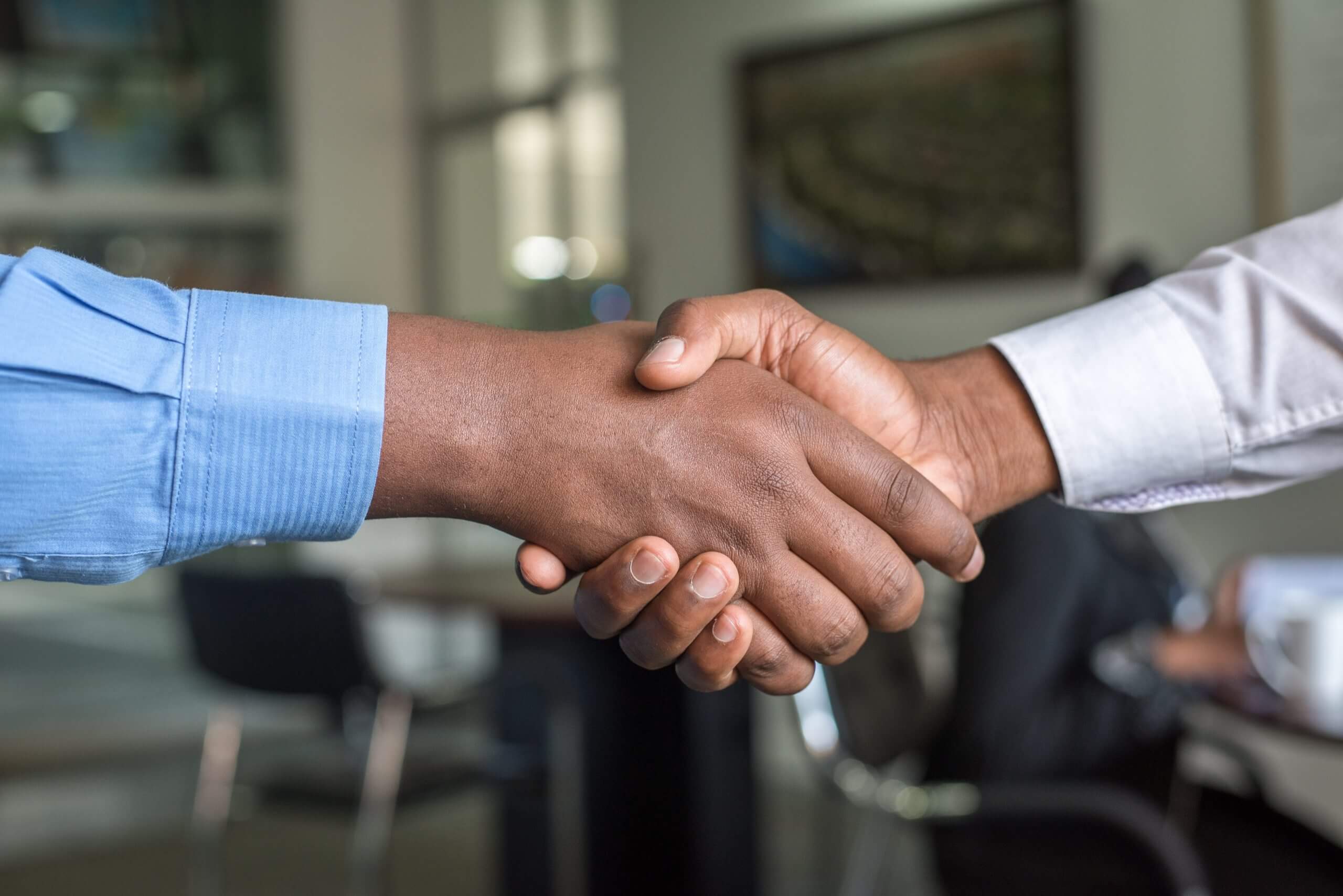 Close up of a handshake - signifying a business deal.