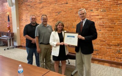 Lt. Gov. Mike Foley presents Nebraska’s Economic Development Certified Community award to Geneva officials.