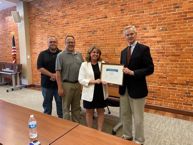 Lt. Gov. Mike Foley presents Nebraska’s Economic Development Certified Community award to Geneva officials.